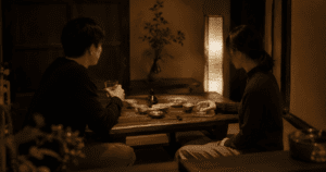 Two Japanese people having a polite conversation, one hiding their true feelings